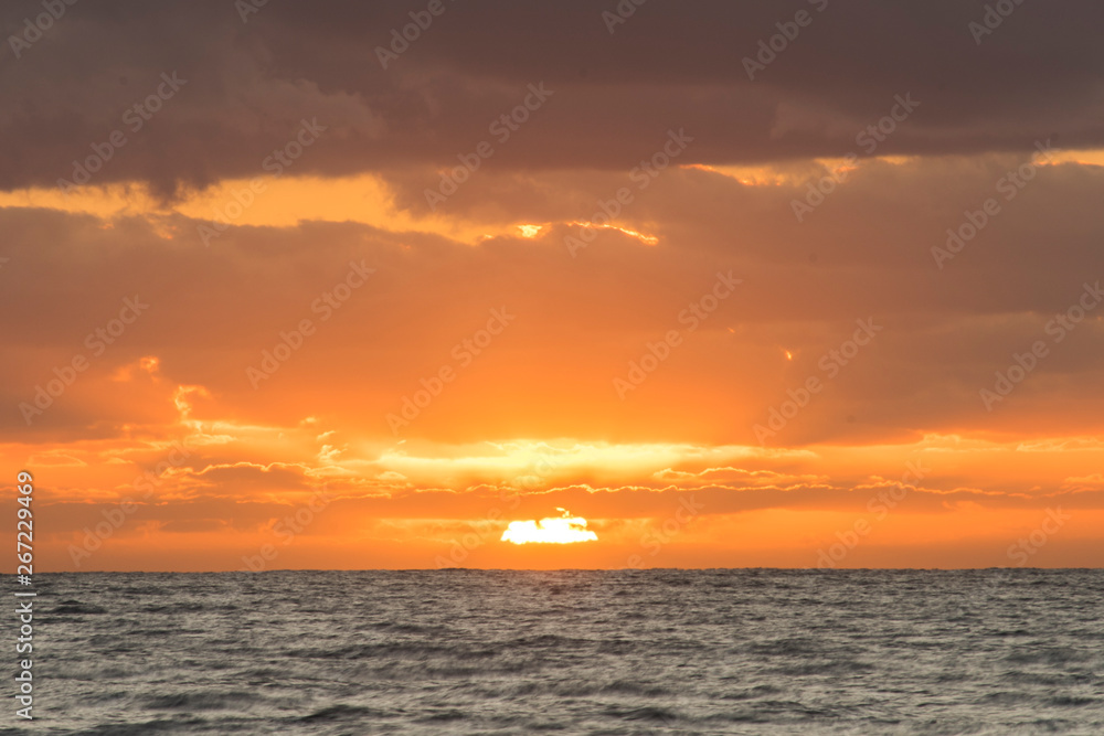 Sun Rising in the Sea