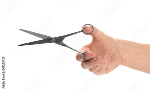 Man holding pair of barber scissors isolated on white, closeup