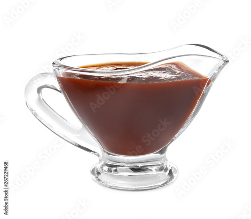 Quadro su tela Glass gravy boat with barbecue sauce on white background