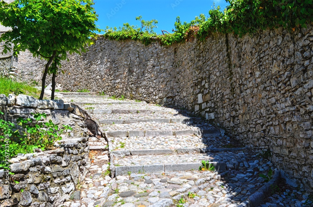 leading up the staircase, lined with rocks