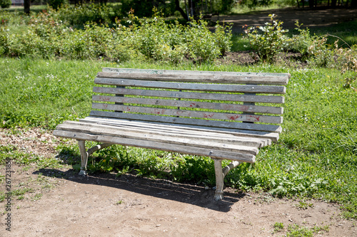 Old bench in the park at summer