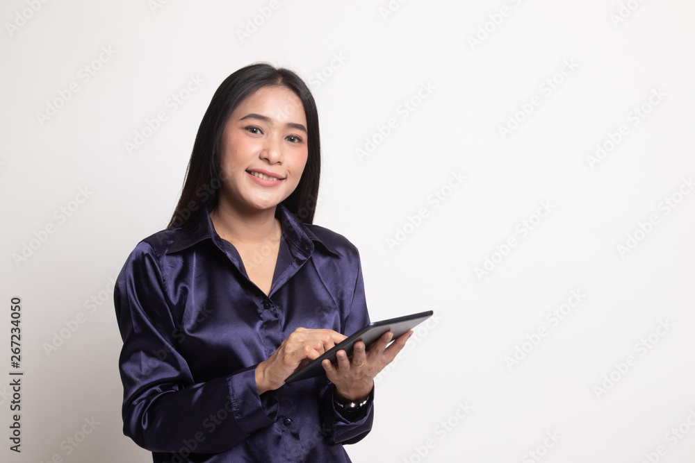Young Asian woman with a computer tablet. Young Asian woman with a computer tablet.