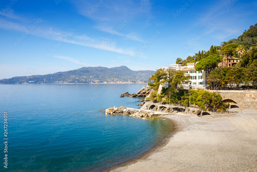 Breathtaking view on Mediterranean sea beach on Liguria region in Italy. Awesome landscape of Zoagli, Cinque Terre and Portofino. Beautiful Italian city with colorful houses.