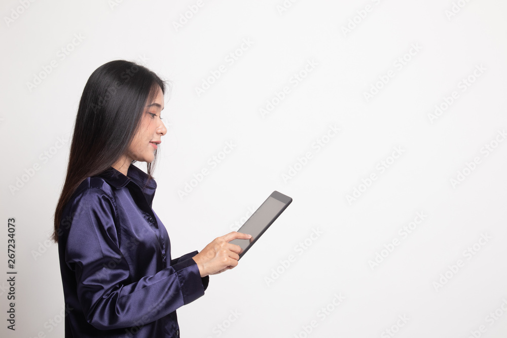 Young Asian woman with a computer tablet. Young Asian woman with a computer tablet.