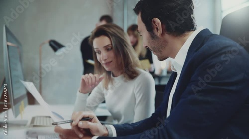 Concept of business team at working process.Young professionals work with new market project. Project managers meeting.Blurred background