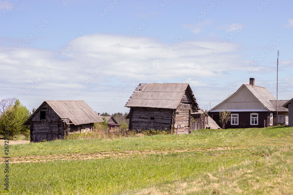 Complex of old wooden houses in a small village in Lithuania Complex of old wooden houses in a small village in Lithuania