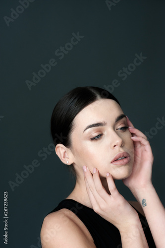 Beauty portrait young female brunette model with hands