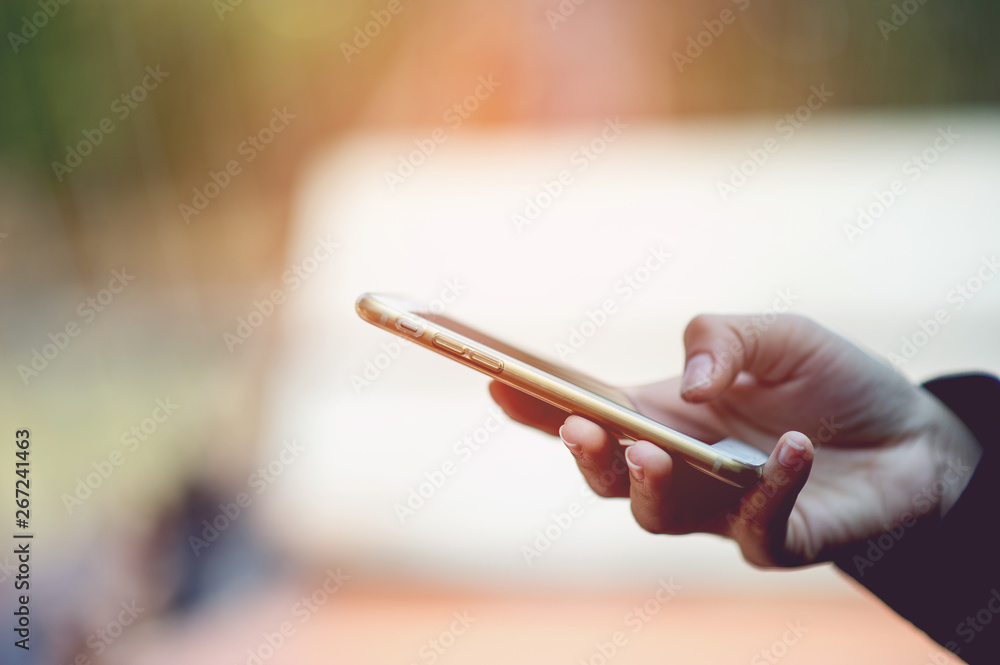 Hands and phones used for online communication Concepts of telephone and technology With copy space Hands and phones used for online communication Concepts of telephone and technology With copy space