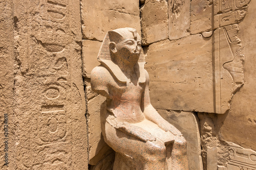 Seated statue of Pharaoh Thutmose III at the Karnak Temple Complex in Luxor, Egypt