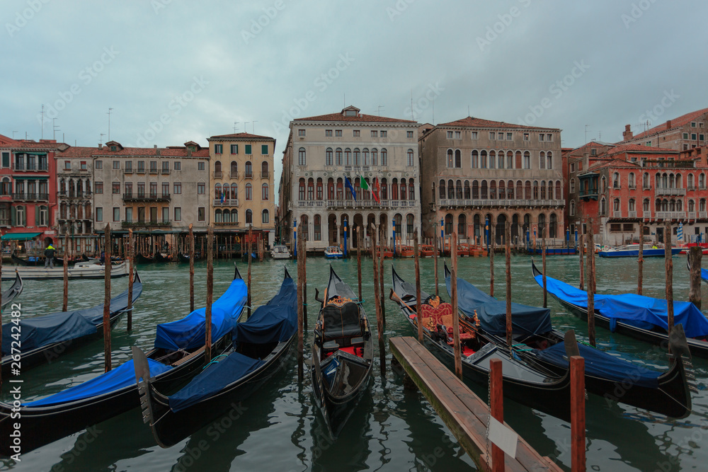 Venice, Italy - 2019 January 18: Covered Gondolas atz the Canale Grande (