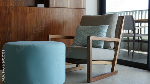 chair and stool in a living room setting