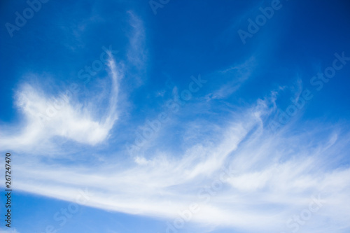 saturated vivid blue sky with white clouds natural background 