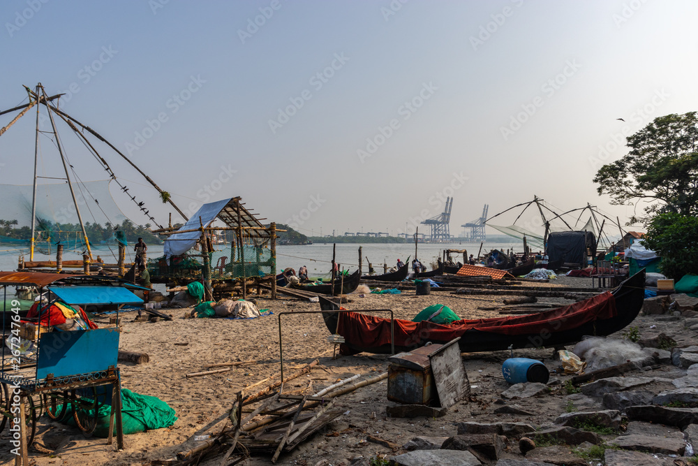 Fisherman and its Fishing nets in the morning hours at kochi kerala cost