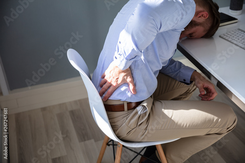 Businessman with lower back ache