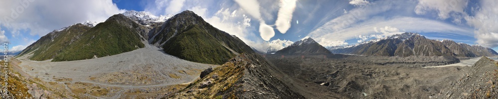 Obraz premium Panorama of the Tasman Glacier in New Zealand with blue sky and clouds