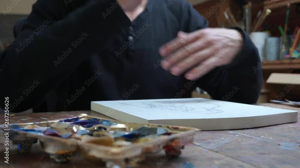 Man takes a pencil, ready to draw, Man takes a pencil, ready to draw,