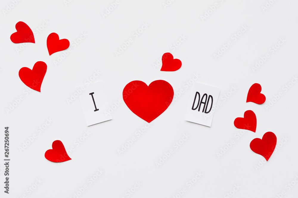 Fathers day. Message and many paper hearts on white background. Top view. Birthday Fathers day. Message and many paper hearts on white background. Top view. Birthday