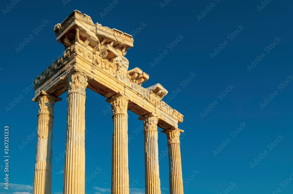 The ruins of the Temple of Apollo in ancient sity of Side in Turkey against the blue sky clouse-up