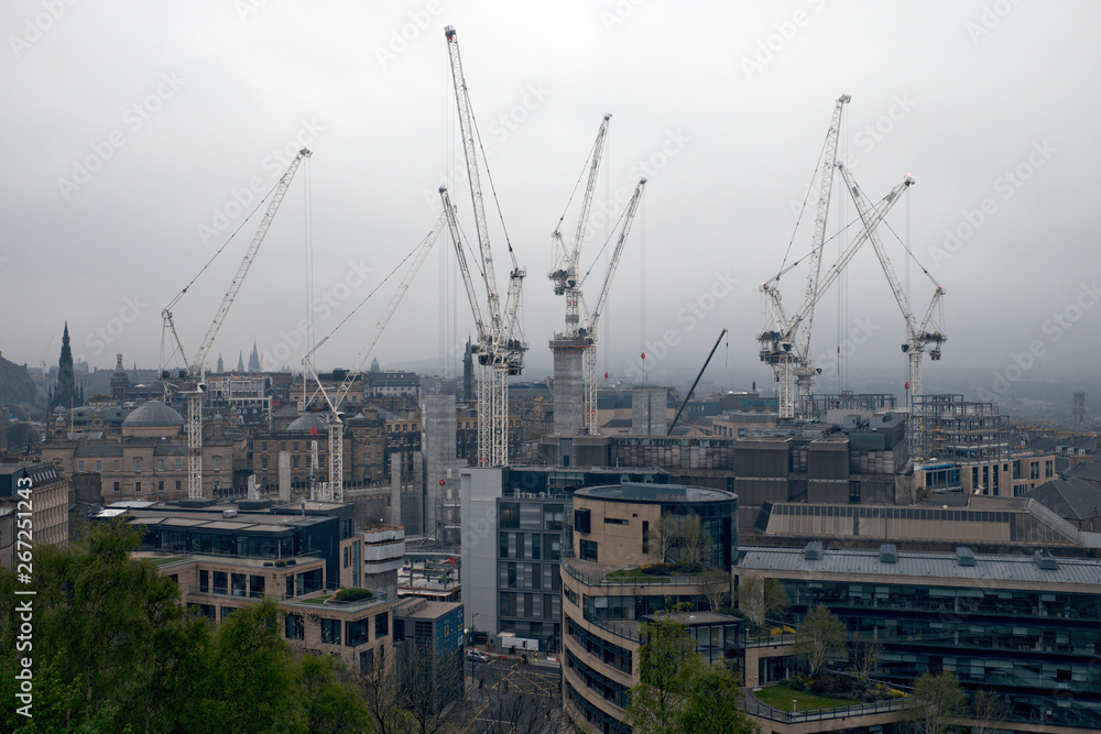 April - 2019. Tall cranes on a construction site in the city of Edinburgh, United Kingdom