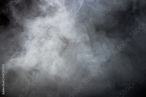 Smoke and dense fog on black background.