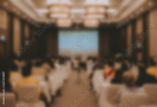 audience & stage in seminar conference room. blur background
