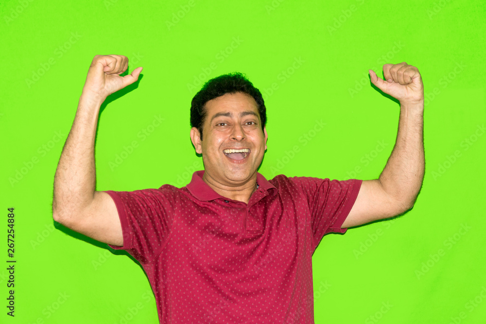 Fototapeta premium Young Indian man cheering