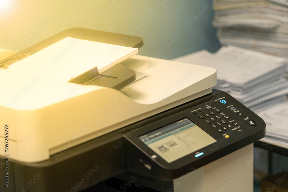 Multi-function machines and documents waiting for scanning or copying Multi-function machines and documents waiting for scanning or copying
