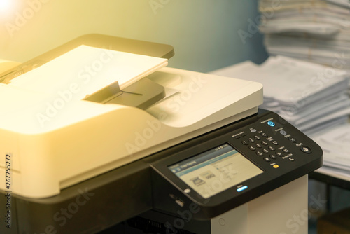 Multi-function machines and documents waiting for scanning or copying