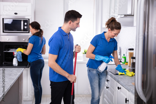 Janitors Cleaning Kitchen