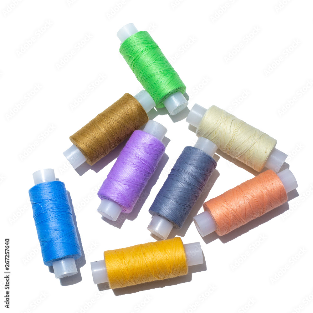spools of thread and different colors isolated spools of thread and different colors isolated