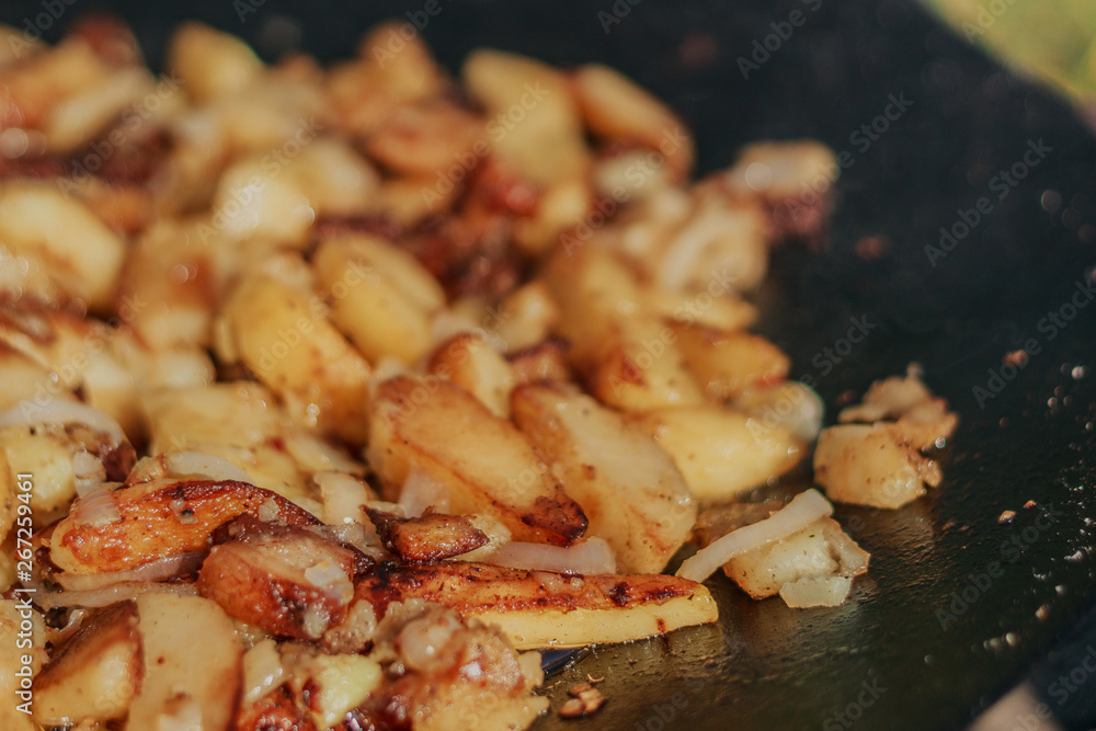 Fried Golden Potatoes on the grill. Cooking food in nature. Cooking food on fire. Fried Golden Potatoes on the grill. Cooking food in nature. Cooking food on fire.