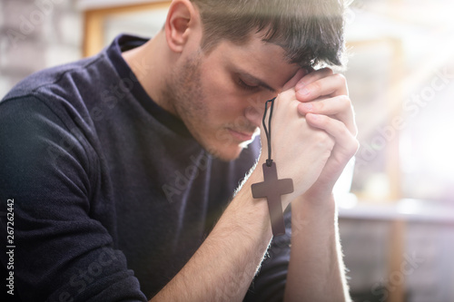 Man Holding Wooden Cross