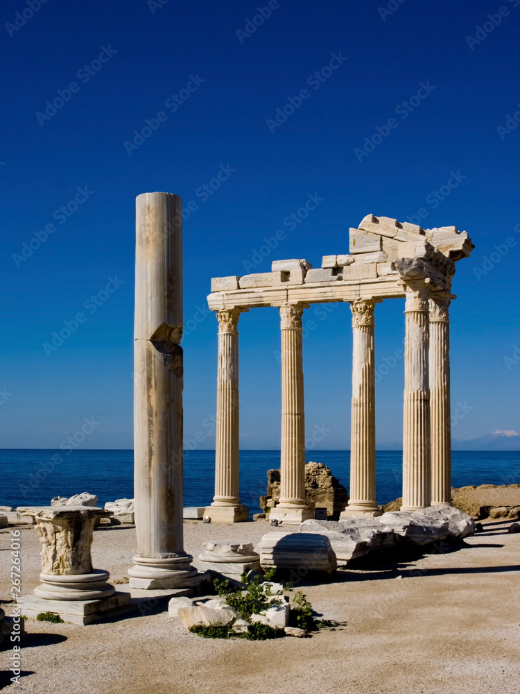 The remains of the temple of Apollo at Side on the southern coast of Turkey. Showing the remains with the deep blue sky of the Mediterranean.  