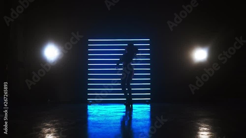 Silhouette of a girl who is dancing dance