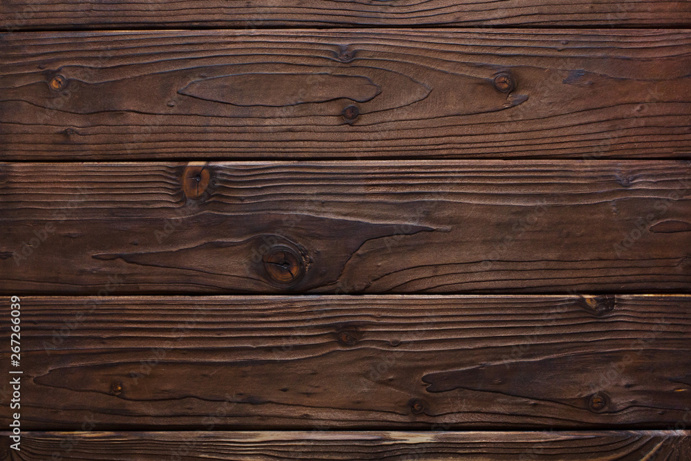 Texture of dark brown wooden planks Texture of dark brown wooden planks