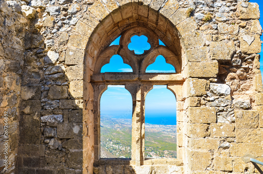 Beautiful window view from ancient St. Hilarion Castle in Northern Cyprus. The amazing view point offers a beautiful view over Cypriot Kyrenia region and Mediterranean. Popular tourist attraction