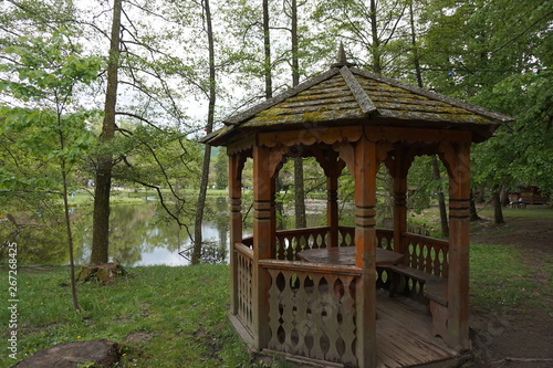Wooden gazebo near the pond or lake.