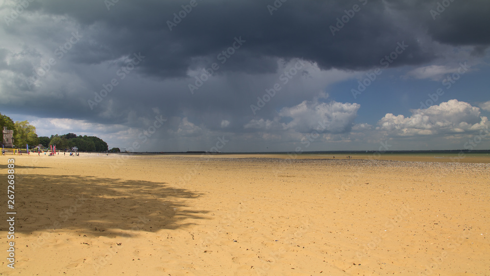 Looming rain clouds over Ryde sands with Appley tower Looming rain clouds over Ryde sands with Appley tower
