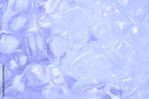 ice cube floating on water in plastic tray