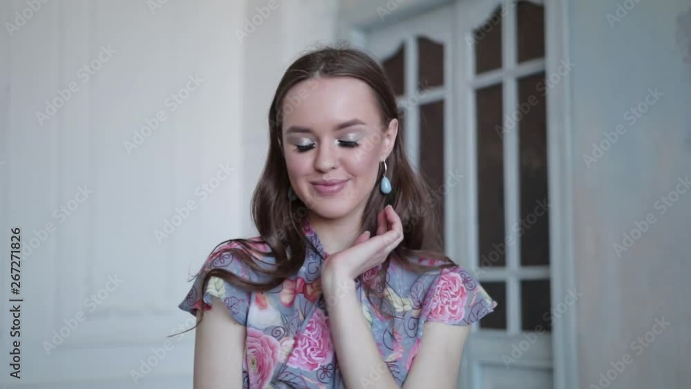 pretty girl in a beautiful blouse having fun and spinning on the background of a beautiful door, slow motion pretty girl in a beautiful blouse having fun and spinning on the background of a beautiful door, slow motion
