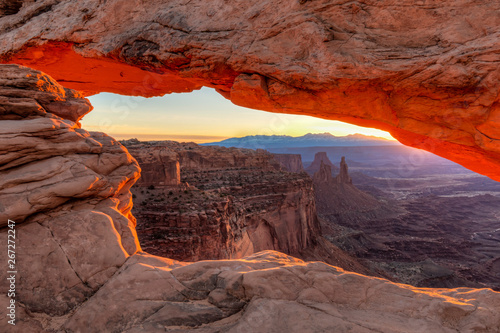 Orange sunrise glow on Mesa Arch