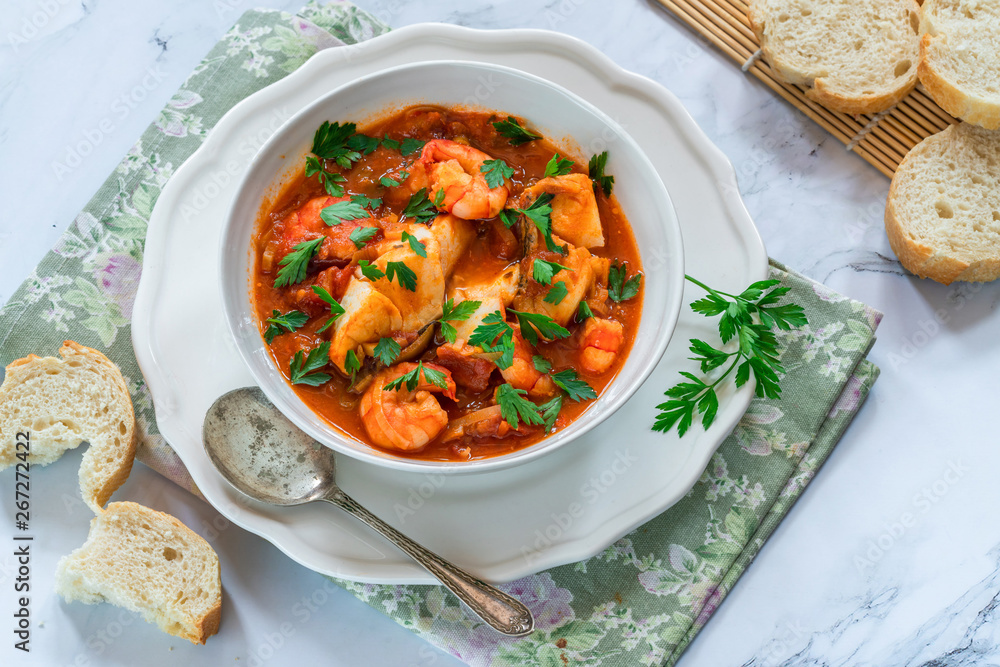 Tiger prawn and fish stew in a bowl- top view Tiger prawn and fish stew in a bowl- top view