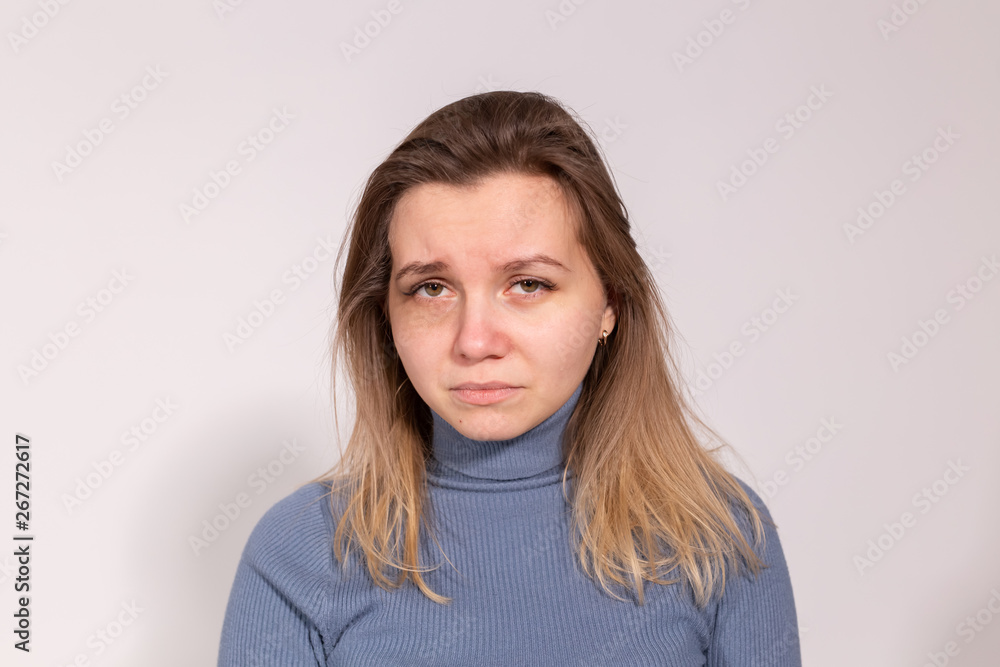 People, violence and abuse concept - Close-up portrait of crying woman with smeared mascara People, violence and abuse concept - Close-up portrait of crying woman with smeared mascara