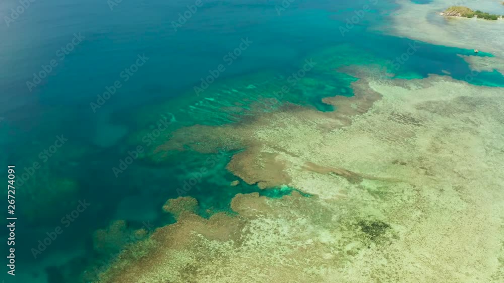 Aerial view lagoon with coral reef, atoll and turquoise water. Busuanga, Palawan, Philippines. Seascape island and clear blue water tropical landscape Aerial view lagoon with coral reef, atoll and turquoise water. Busuanga, Palawan, Philippines. Seascape island and clear blue water tropical landscape