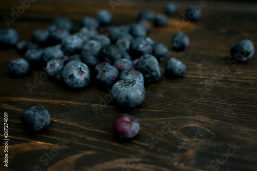 Blueberries on Dark Wood Background