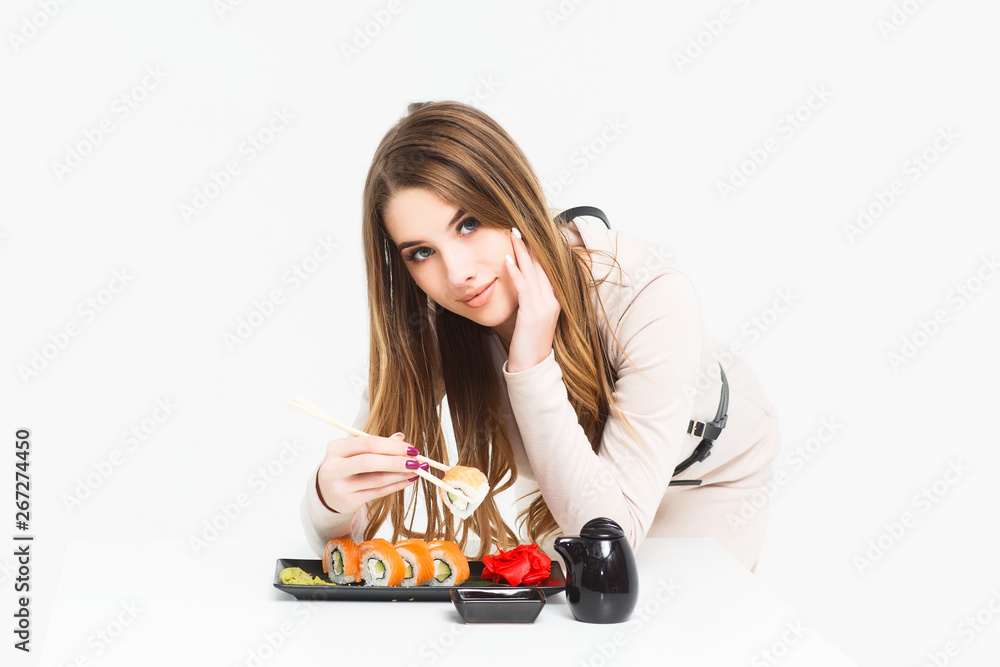 Woman posing with fresh sushi set , isolated on white background! Woman posing with fresh sushi set , isolated on white background!