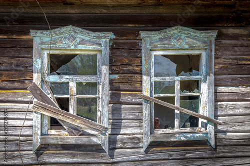 Windows with broken glass of an old abandoned house in Belarus Chernobyl exclusion zone in Belarus