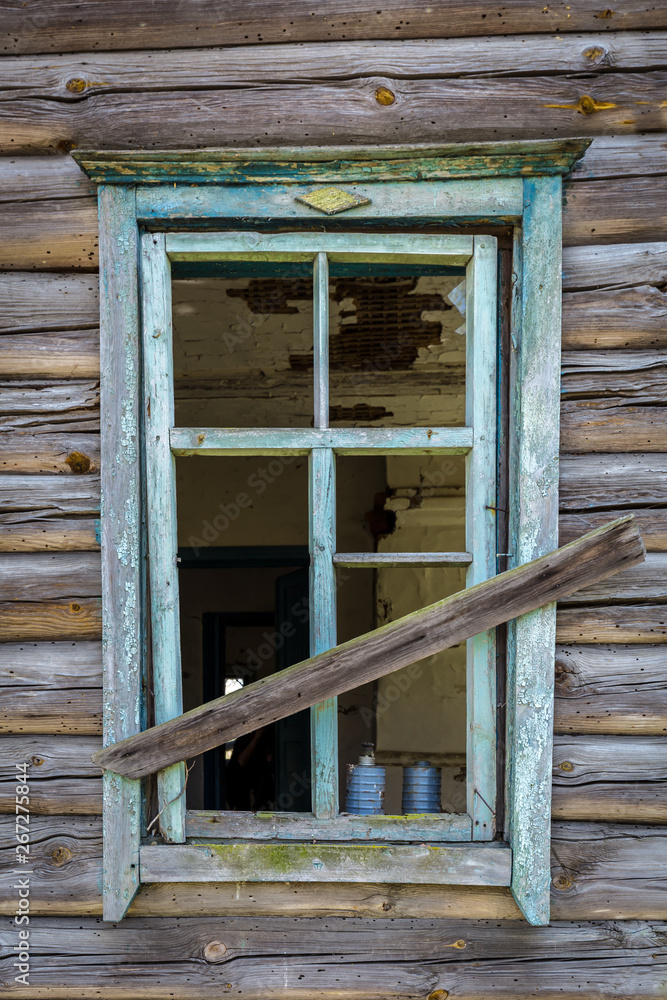 Windows with broken glass of an old abandoned house in Belarus Chernobyl exclusion zone in Belarus Windows with broken glass of an old abandoned house in Belarus Chernobyl exclusion zone in Belarus