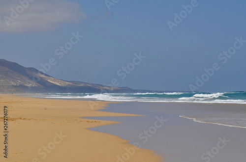 Beautiful empty sandy beach Cofete, Fuerteventura Canarias. Mountains background 