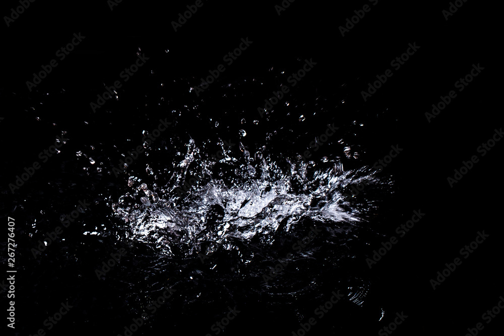 Splash of water. Isolate on black background Splash of water. Isolate on black background